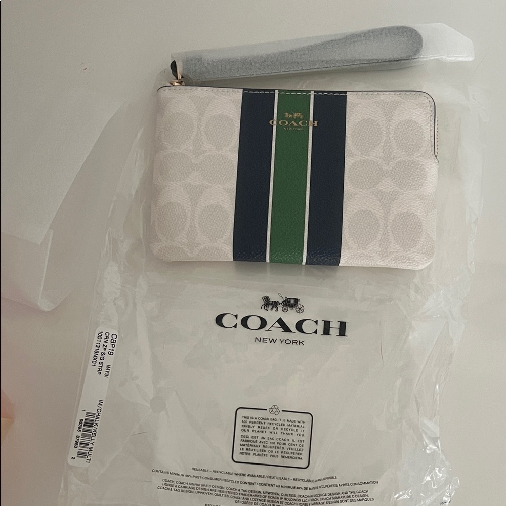 NWT NWT (Coach) CORNER ZIP WRISTLET IN SIGNATURE
CANVAS WITH VARSITY STRIPE
